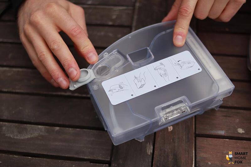 The Roborock Q7 Max combo-bin is on the table.